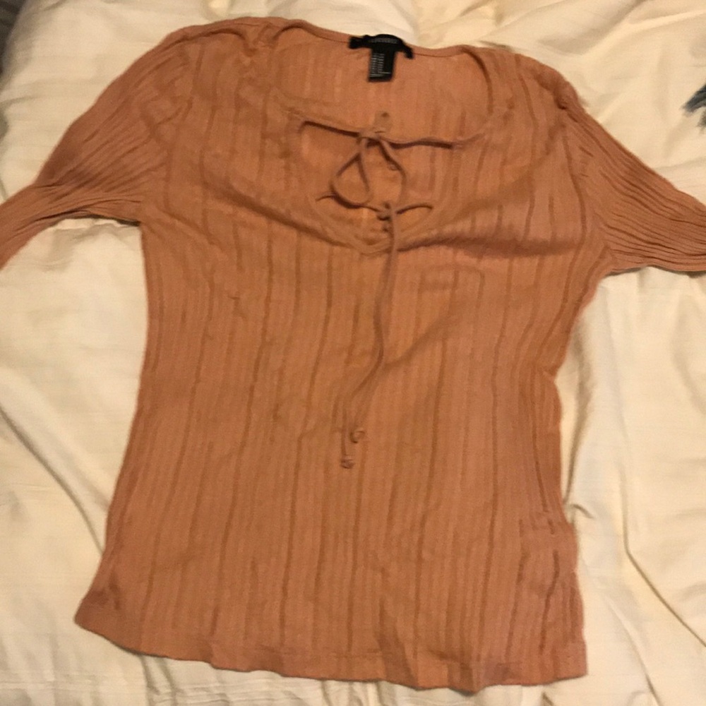 Long sleeve pink shirt.